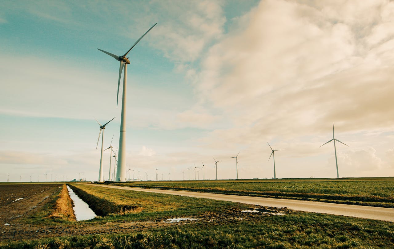 creative-03 Scenic view of wind turbines in a rural Dutch landscape, generating renewable energy.